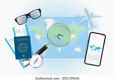 Conceptual illustration of a trip to Croatia with travel gear. World map with compass, passport, tickets, cell phone, plane and glass.