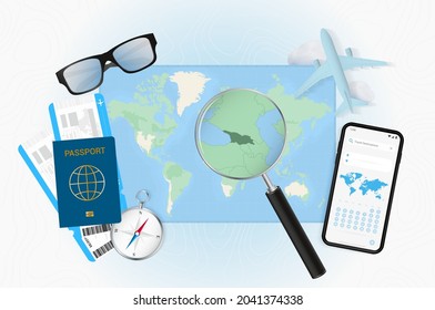 Conceptual illustration of a trip to Georgia with travel gear. World map with compass, passport, tickets, cell phone, plane and glass.