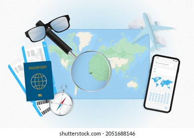 Conceptual illustration of a trip to Guinea-Bissau with travel gear. World map with compass, passport, tickets, cell phone, plane and glass.