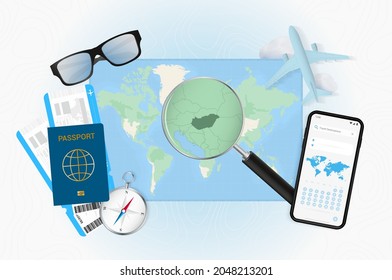 Conceptual illustration of a trip to Hungary with travel gear. World map with compass, passport, tickets, cell phone, plane and glass.