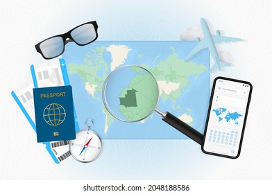 Conceptual illustration of a trip to Mauritania with travel gear. World map with compass, passport, tickets, cell phone, plane and glass.