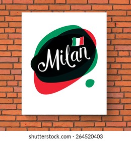 Conceptual Milan Text on Abstract Green and Red Background with Small Italian Flag on White Cardboard Hanging on the Brick Wall.