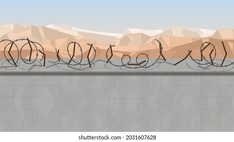 Concrete wall with destroyed barbed wire against the backdrop of a mountainous, sandy landscape. Afghanistan, local landscape, wall with space for text or illustration.