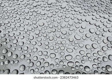 Condensation water drops on black glass background. Rain droplets with light reflection on dark window surface, abstract wet texture, scattered pure aqua blobs pattern Realistic 3d vector illustration