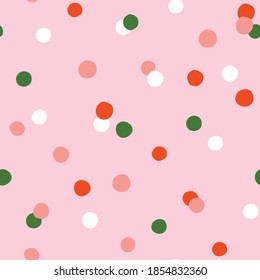 Confetti abstract vector seamless pattern. Hand-drawn geometrical  repeated background for holidays. Christmas or birthday polka dots print in pink and green colors.
