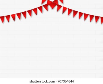 Confetti and flag ribbons over white tile wall