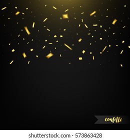 Confetti isolated on dark background with light. Golden confetti. Confetti with motion effect