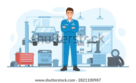 Confident auto mechanic stands in modern garage with car lifted on hoist.