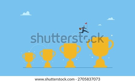 Confident businessman jumping from small win trophy to get bigger one. Small win or achievement to motivate to achieve bigger goal, strategy or inspiration to success, victory or win award.
