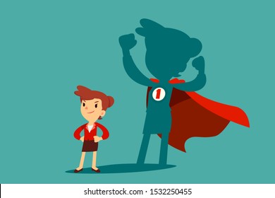 Confident businesswoman standing in front of her shadow wearing red cape as a superhero. Business ambition concept.
