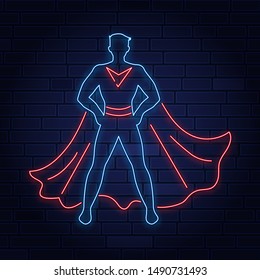 Confident superhero neon sign. Leadership, power, protector design. Night bright neon sign, colorful billboard, light banner. Vector illustration in neon style.