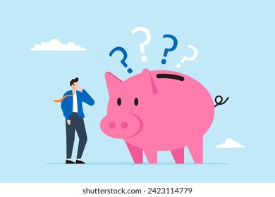 Confused businessman with piggybank and question marks