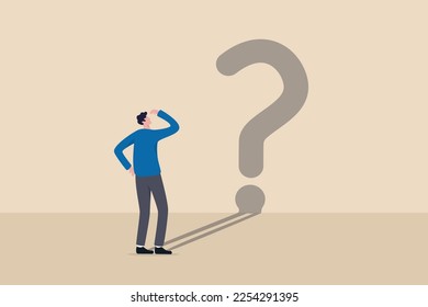 Confusion, uncertainty or self doubt, finding meaning in live, question to answer or searching solution to solve problem concept, curios businessman looking at self shadow as question mark sign.