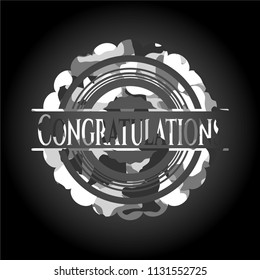 Congratulations written on a grey camouflage texture