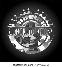 Congratulations written on a grey camouflage texture