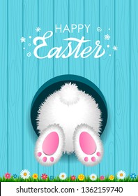 Congratulatory Easter card with a hand-written inscription Happy Easter and a white fluffy rabbit from below in a hole against the background of a wooden texture with green grass. vector illustration