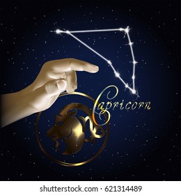 Constellation of the sign of the zodiac against the background of the starry sky and finger of the hand.