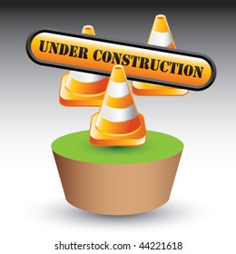 construction cones and sign on green patch