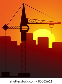 construction crane against the evening city