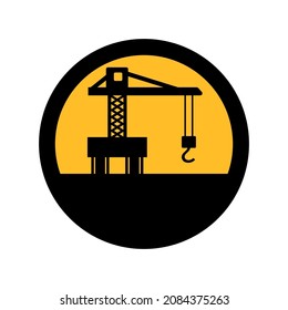 Construction crane, black and yellow colors, round sign for design on a white background, vector illustration