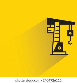 construction crane icon with shadow on yellow background