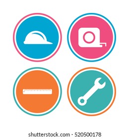 Construction helmet and wrench key tool icons. Ruler and tape measure roulette sign symbols. Colored circle buttons. Vector