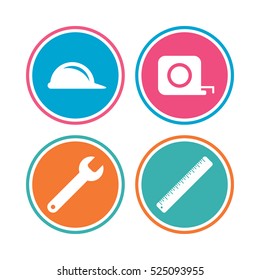 Construction helmet and wrench key tool icons. Ruler and tape measure roulette sign symbols. Colored circle buttons. Vector