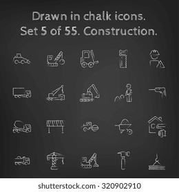 Construction icon set hand drawn in chalk on a blackboard vector white icons on a black background.