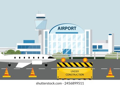 Construction near airport with caution signs and cones, airport terminal, aircraft, perimeter fence