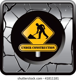 signo de construcción en botón web de resquebrajamiento plateado