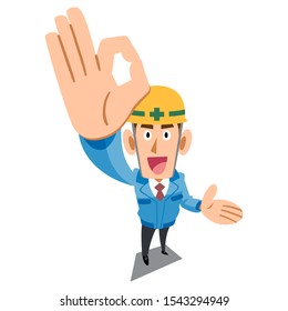 Construction site worker wearing blue work clothes showing OK sign by hand and guiding