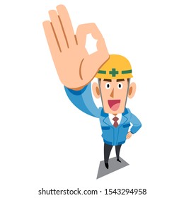 Construction site worker wearing blue work clothes showing OK sign by hand