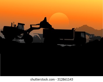 Construction vehicles at site silhouette