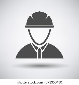 Construction worker head in hemlet  icon on gray background with round shadow. Vector illustration.