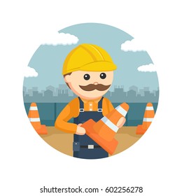 construction worker holding construction cones in circle background