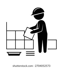 Trabajador de la construcción instalando azulejos en una pared