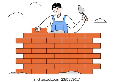 Construction worker lays bricks to build new house