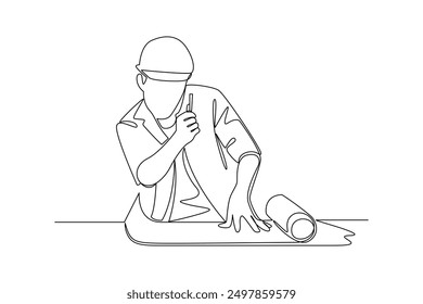 construction worker opens a piece of paper. Labor Day