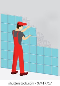 Construction worker in red suit laying tiles