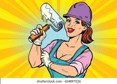 Construction worker with roller for paint. Woman professional