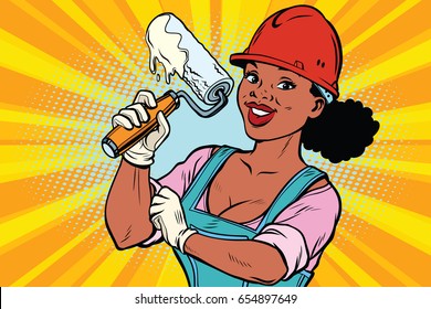 Construction worker with roller for paint. Woman professional