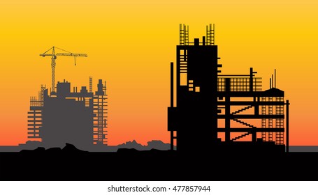 construction worker silhouette at work ,
cranes and skyscraper under construction, City skyline at sunset