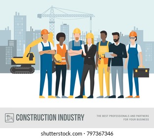 Construction workers and engineers posing together at the construction site, machinery and crane on the background