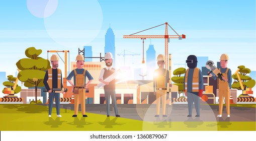 construction workers team industrial technicians builders group over city construction site tower cranes building residential buildings cityscape background flat horizontal full length