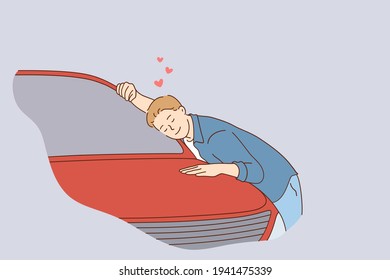 Consumerism, buying new vehicle, shopping concept. Young happy man cartoon character sitting with eyes closed embracing new car at dealership showroom feeling pleased vector illustration 