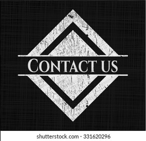 Contact us chalk emblem written on a blackboard