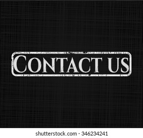 Contact us chalk emblem written on a blackboard