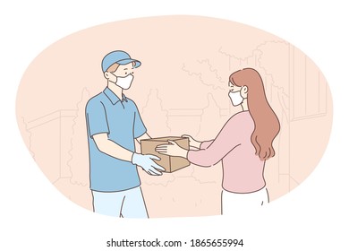 Contactless delivery, courier, online order concept. Young man courier deliveryman in protective medical mask and gloves giving order in box to woman customer. Parcel, logistics during pandemic 