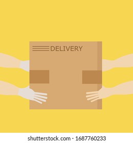 Contactless delivery of products, food, books, goods. Hands passing the box from hand to hand. Protect yourself from the virus. COVID-19 pandemic.