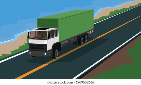 Container truck transportation journey. Only one man driving on the asphalt road with nature of meadow and sea beach beside.